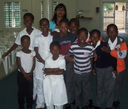 Havest Aftercare teacher and children